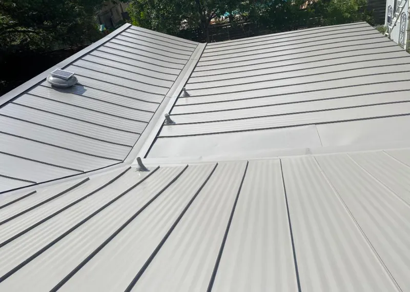 Solar attic fan installed on a metal roof for Roof Ventilation in Vincennes